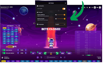 Screenshot do jogo Spaceman com uma seta sinalizando o menu configuração.